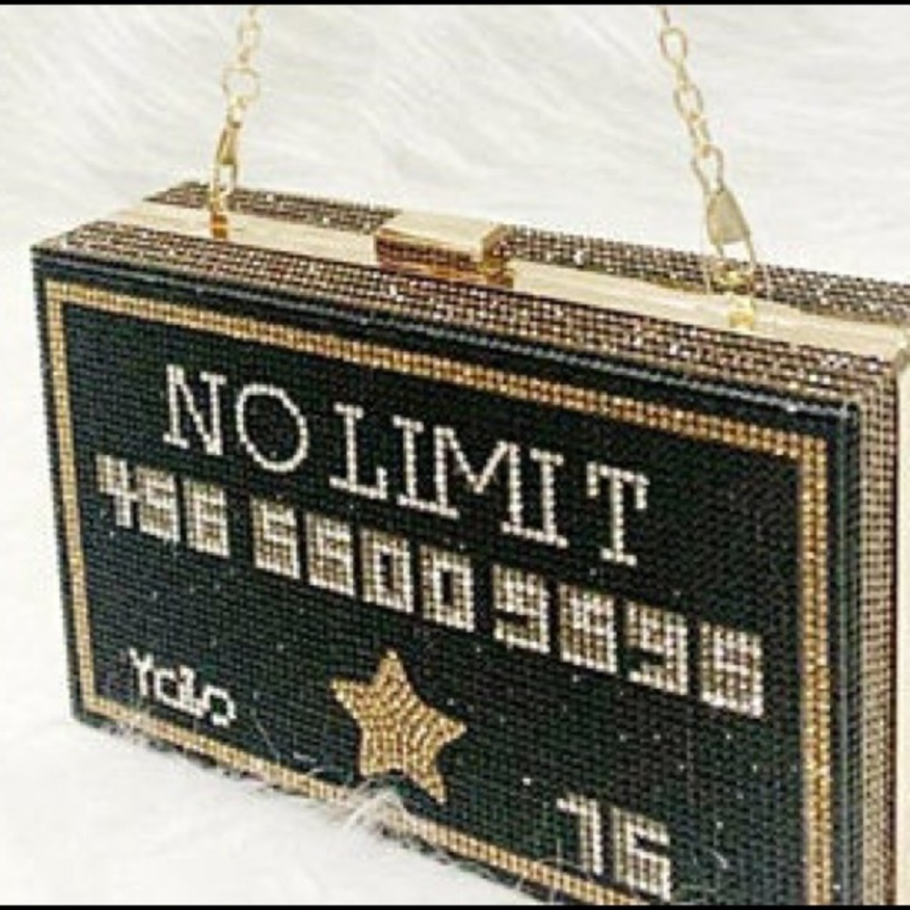 YOLO black sparkle clutch bag